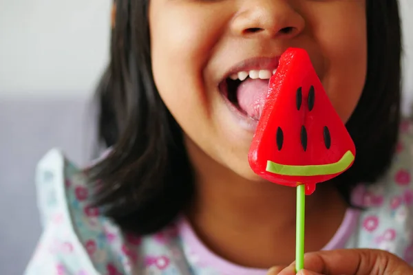 Child Licking Colorful Candy Stick — Stock Photo, Image