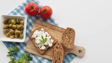 fresh paneer on a bread on table .