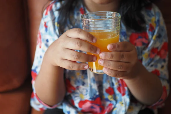 Child Hand Holding Glass Orange Juice — Stock Photo, Image