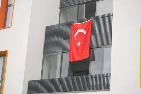 Turkish flag hanging on the window.