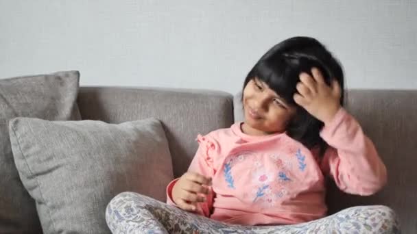 Child Itchy Scalp Hair Sitting Sofa — Stock Video