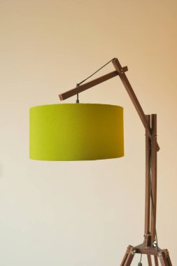 a lamp in home against white wall .