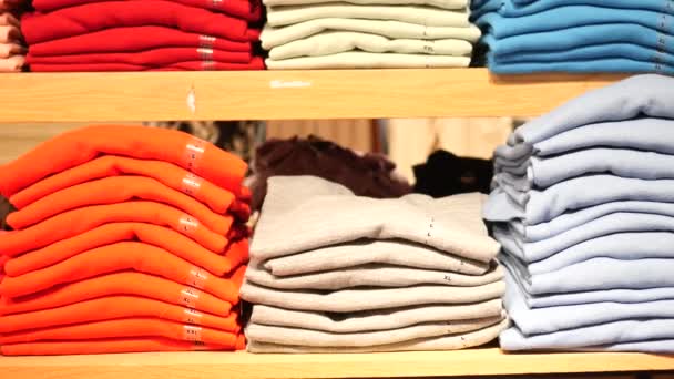 Close Colorful Shirts Shelf Shop — Stock video