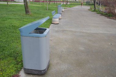 Bag with garbage and rubbish bin,