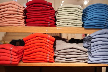 Close up of Colorful Shirts on shelf in a shop ,