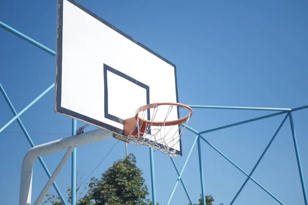 empty Basketball court against blue sky .