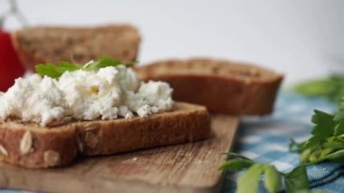 fresh paneer on a bread on table .
