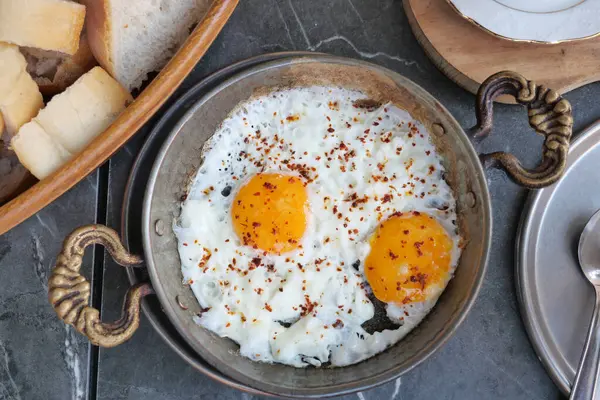 Fried eggs in the plate close up ,,