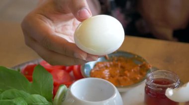 women hand perfectly Peeled Boiled Eggs .