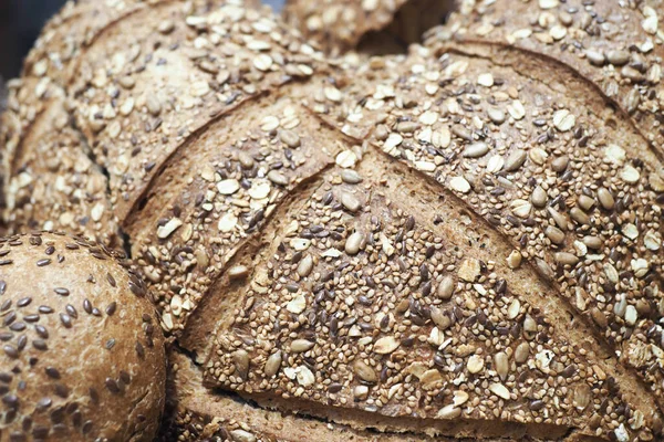 close up of slice of whole grain bread .