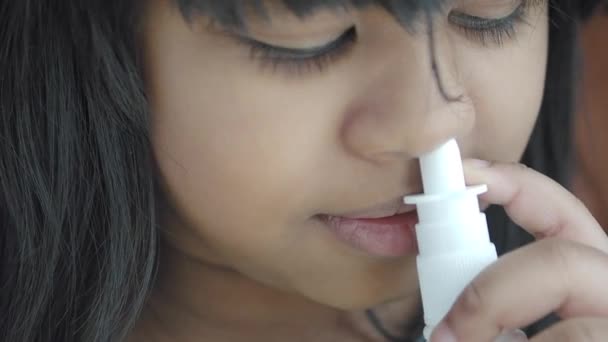 Close Sick Child Using Nasal Medicine Spray — Stockvideo