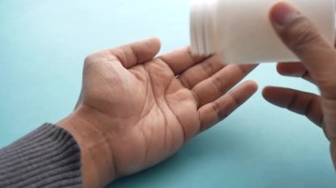 young men taking medical pill .