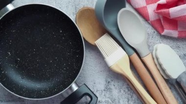  wooden cutlery fork and spoon on a chopping board on table ,