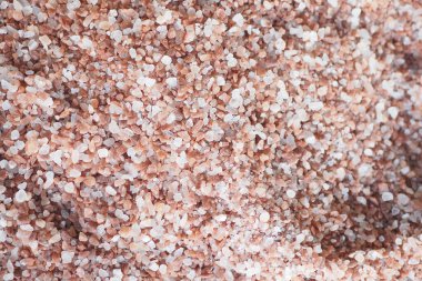 Raw dried pink Himalayan salt .