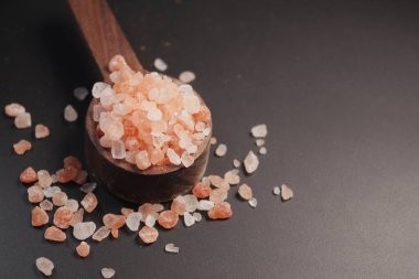 Raw dried pink Himalayan salt .