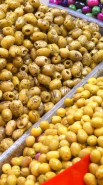 Buckets of olives for sale street food market.