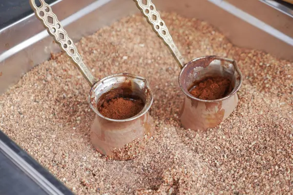 top view of making traditional turkish coffee on sand