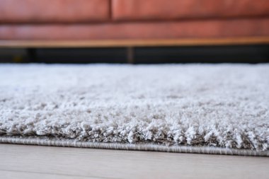 Ahşap zemin üzerinde kopya alanı olan halı dokusu arkaplanı .