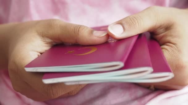 Women Holding Stack Red Color Passport — Stock Video
