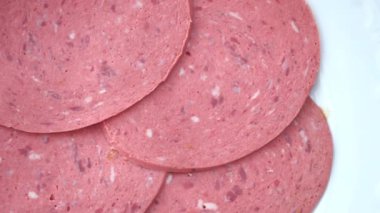 salami sausage cut into thin pieces .