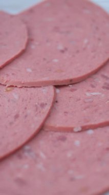 salami sausage cut into thin pieces .