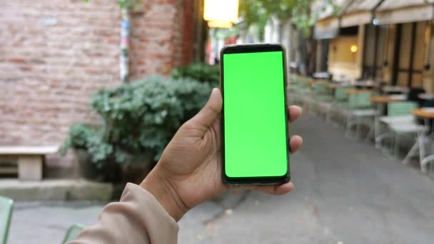 Holding Smart Phone Empty Screen Blurred Cafe Street Background — Stock Video