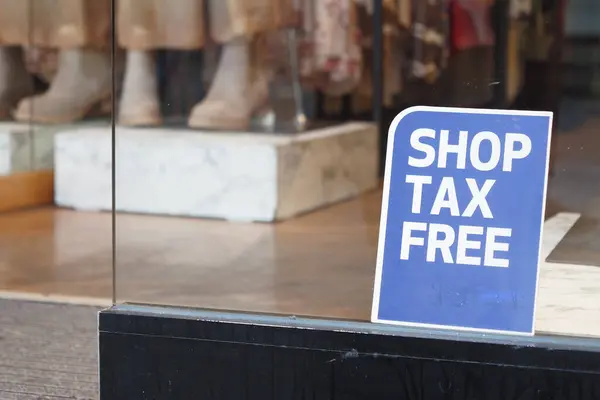 shop tax free text duty free shop sign on shop window ,