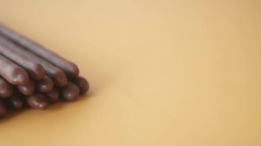 almond nut dark chocolate stick on table .