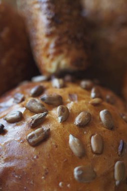 detail shot of sunflower seed baked bread on table .