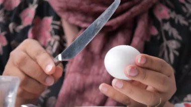 women hand perfectly Peeled Boiled Eggs .