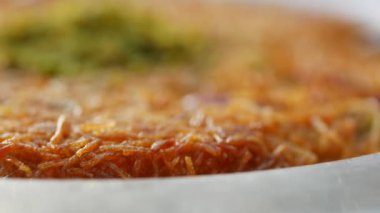 kunafa with a wipe cream on a plate