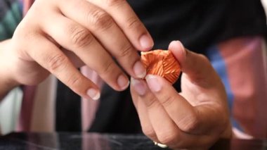 removing packet from a chocolate .