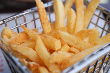 detail shot of French Fries on table .