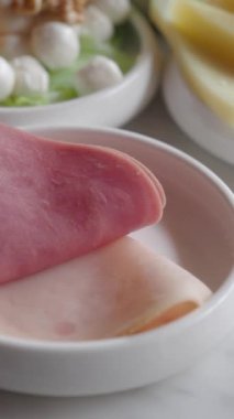 salami sausage cut into thin pieces .