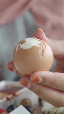 women hand perfectly Peeled Boiled Eggs .