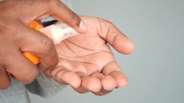  young men using sunscreen cream .