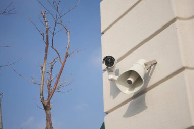 CCTV security camera operating outdoor , clipart
