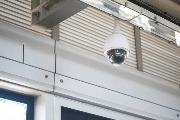 stock image CCTV security camera operating in a metro station .