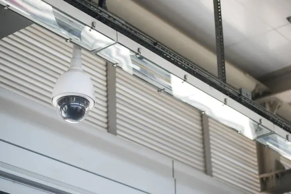 stock image CCTV security camera operating inside of a metro station m