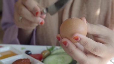 women hand perfectly Peeled Boiled Eggs .