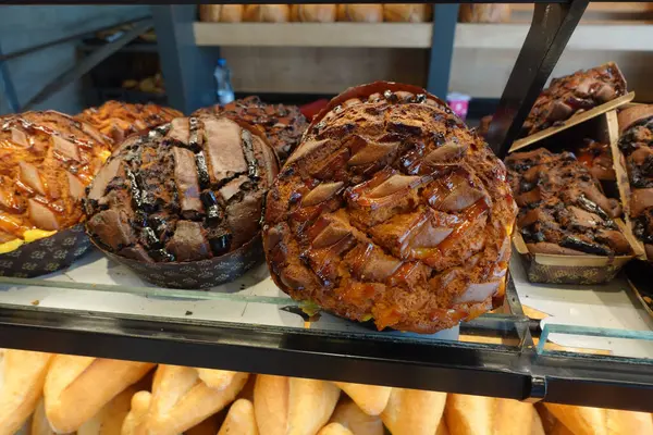 stock image An enticing and mouthwatering display featuring a wide variety of chocolate breads and pastries