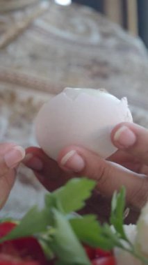 women hand perfectly Peeled Boiled Eggs .