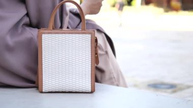 women carrying a pink purse ,