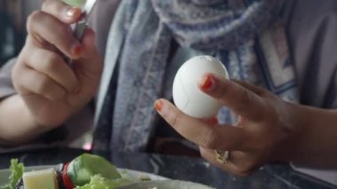 women hand perfectly Peeled Boiled Eggs .
