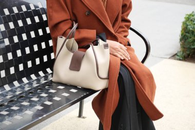 women carrying a pink purse ,