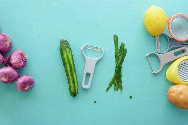 A beautifully aesthetic arrangement of freshly picked vegetables next to a variety of kitchen tools clipart