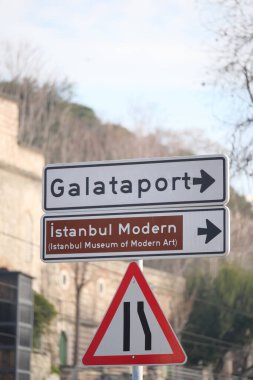 Directional signs guide visitors to Galataport and Istanbul Modern in Turkey. clipart