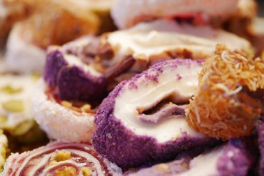 Colorful assortment of turksih delight displayed on a platter.