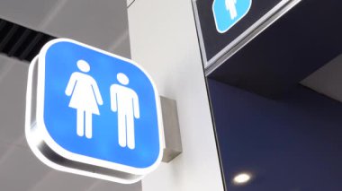 Clear signage indicates male and female restrooms in a public area.