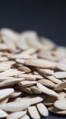 Close-up view of pumpkin seeds scattered after harvest.